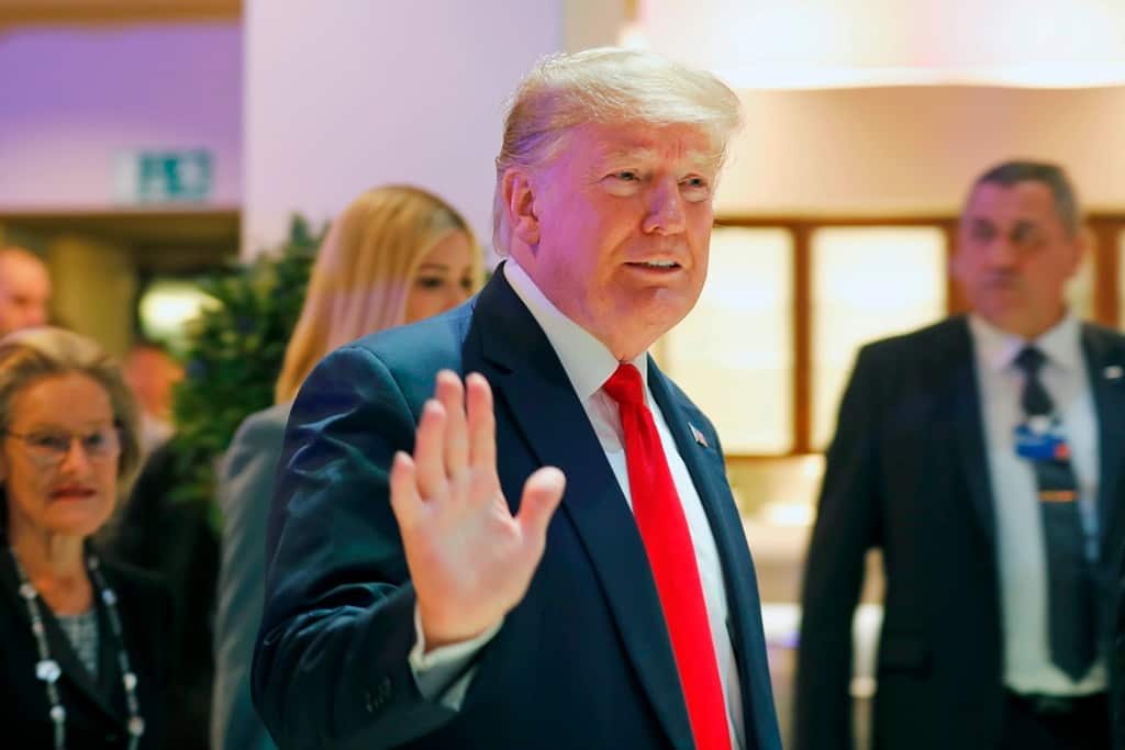 US President Donald Trump waves as he arrives at the World Economic Forum in Davos, Switzerland, Wednesday, Jan. 22, 2020. The 50th annual meeting of the forum is taking place in Davos