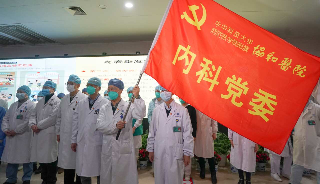 Medical workers in Wuhan form an "assault team" to battle against the deadly coronavirus epidemic.