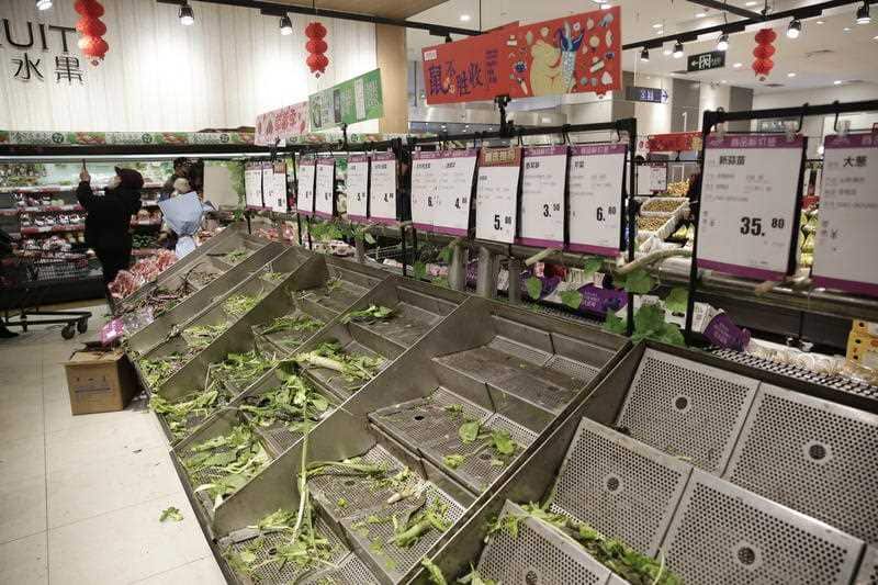 Empty vegetable stalls in a market is seen as people stock up on food due to the coronavirus outbreak in Wuhan