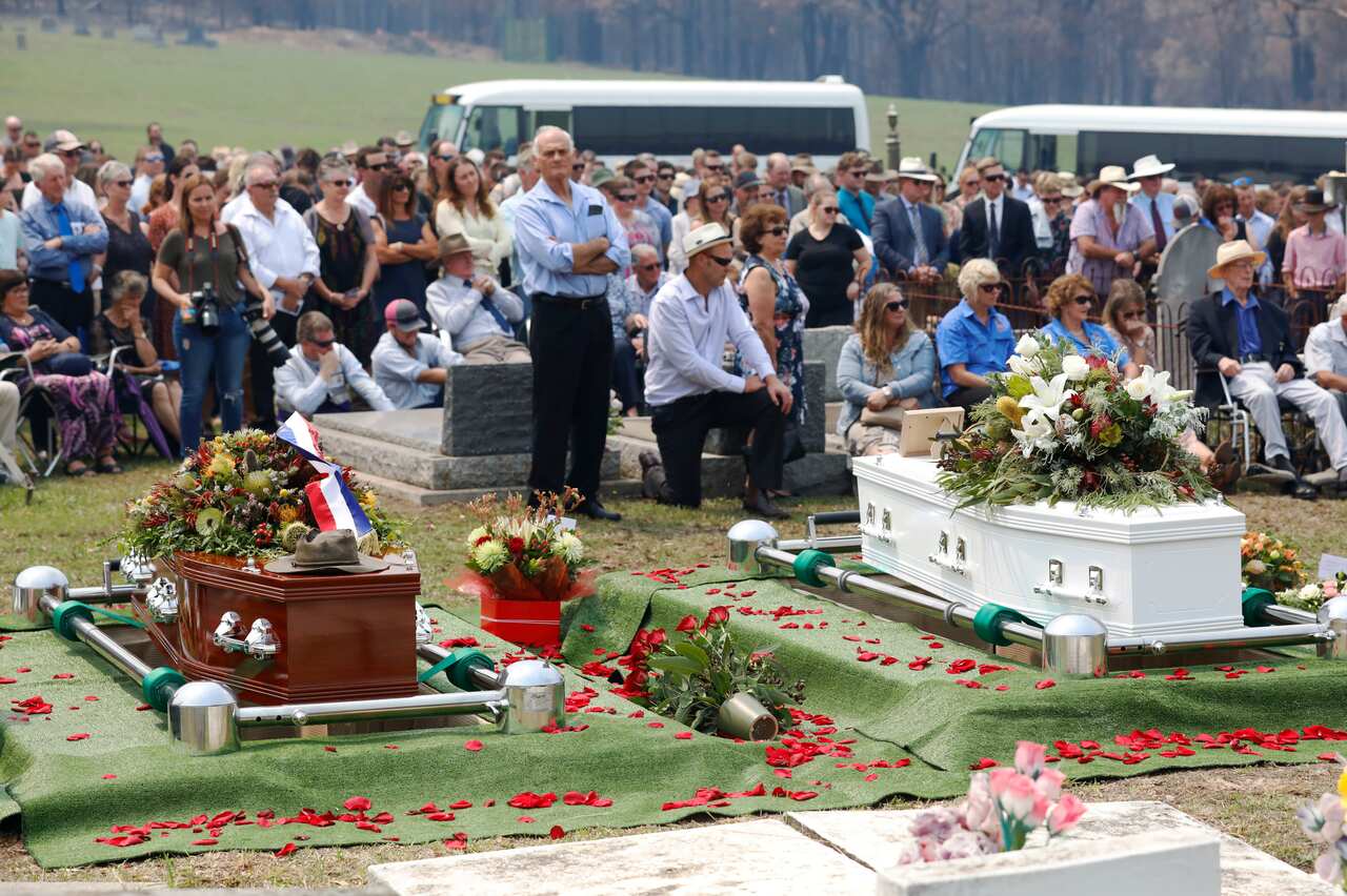 The coffins of Robert (left) and Patrick Salway (right) at Cobargo cemetery in NSW. The father and son perished defending family property overnight in December.