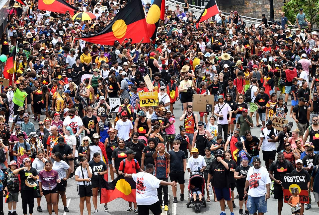 aThousands of people took part in an Invasion Day march in Brisbane.