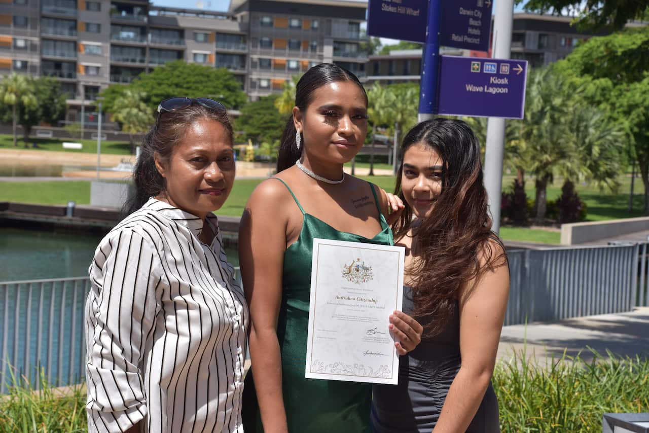 Jefersonia Moniz, centre, after receiving her citizenship on Australia Day in Darwin.
