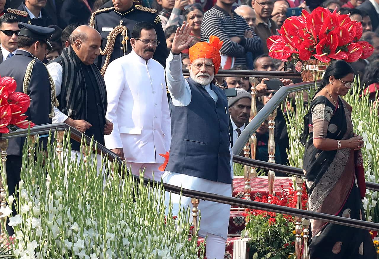 Indian Prime Minister Narendra Modi greets people during the 71st Republic Day celebrations in New Delhi