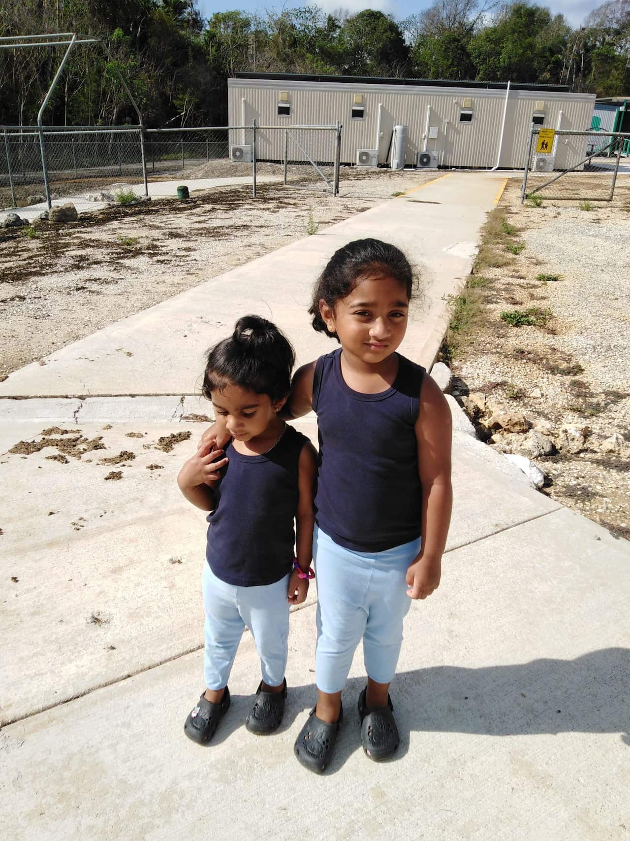Kopika (right) and Tharunicaa, the daughters of the Biloela Tamil family at the detention centre on Christmas Island. 