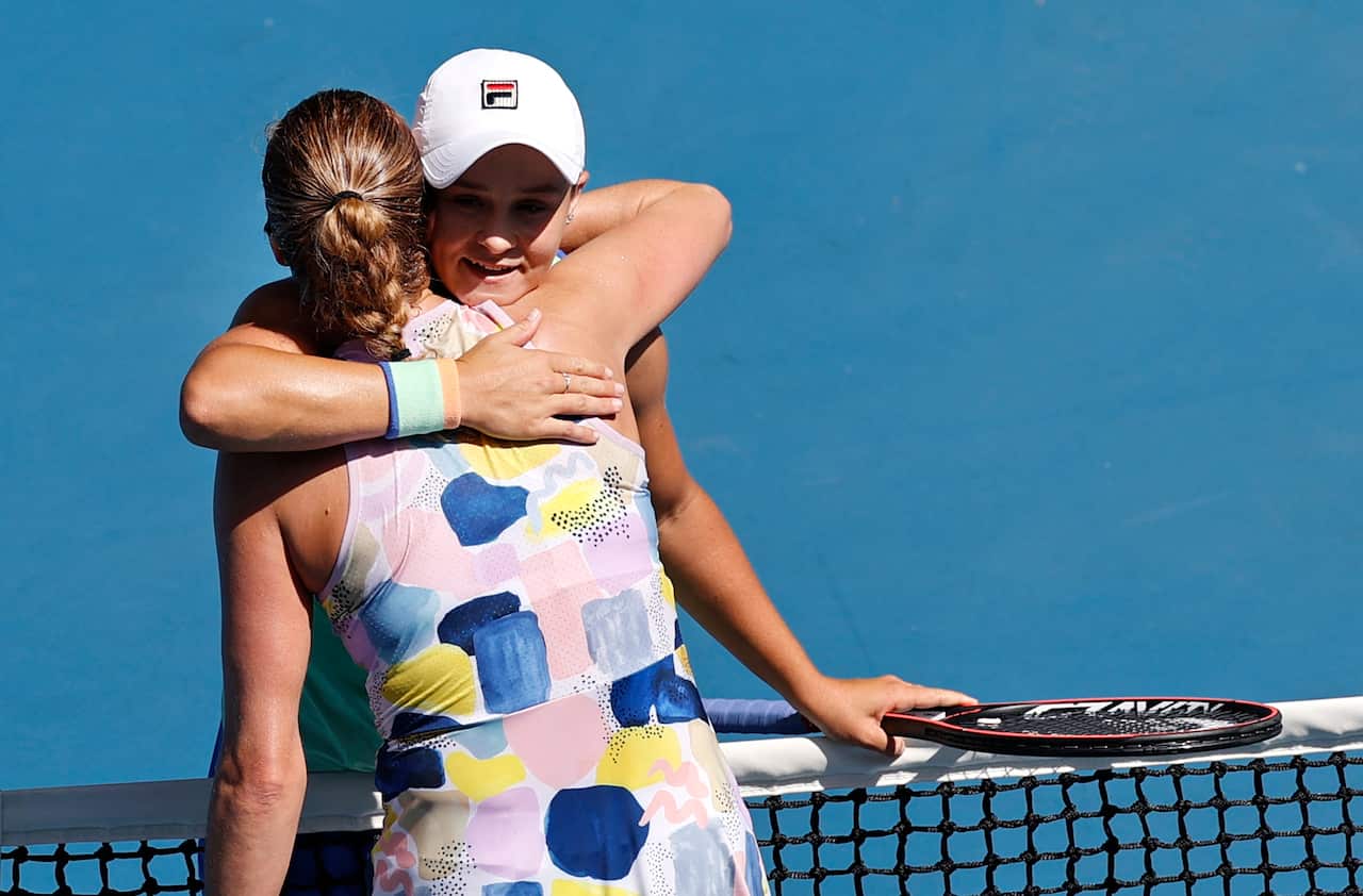 Australia's Ashleigh Barty, right, is congratulated by Petra Kvitova of the Czech Republic after winning their quarterfinal match at the Australian Open tennis championship in Melbourne, Australia, Tuesday, Jan. 28, 2020.(AP Photo/Andy Wong)