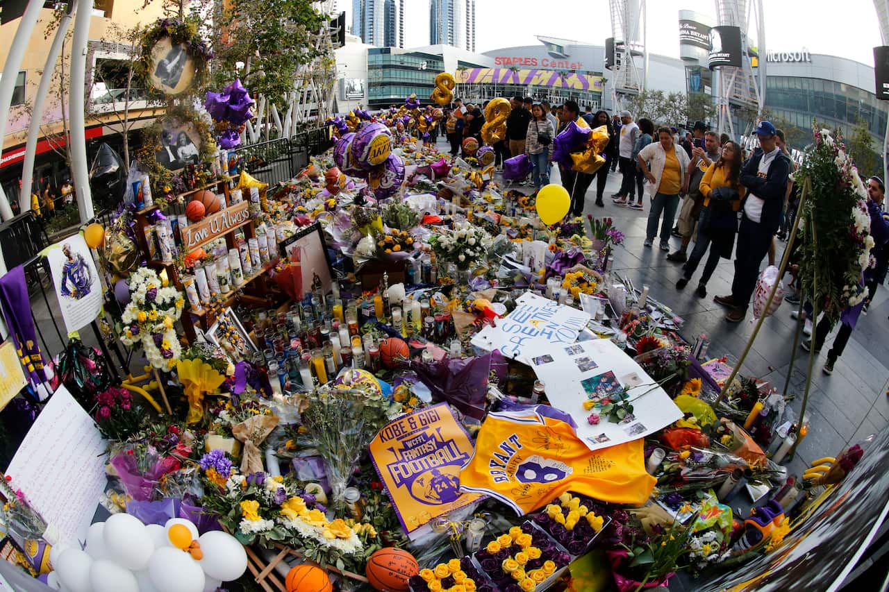Fans gather to pay their respects at a memorial for the late Kobe Bryant near the Staples Center in Los Angeles.