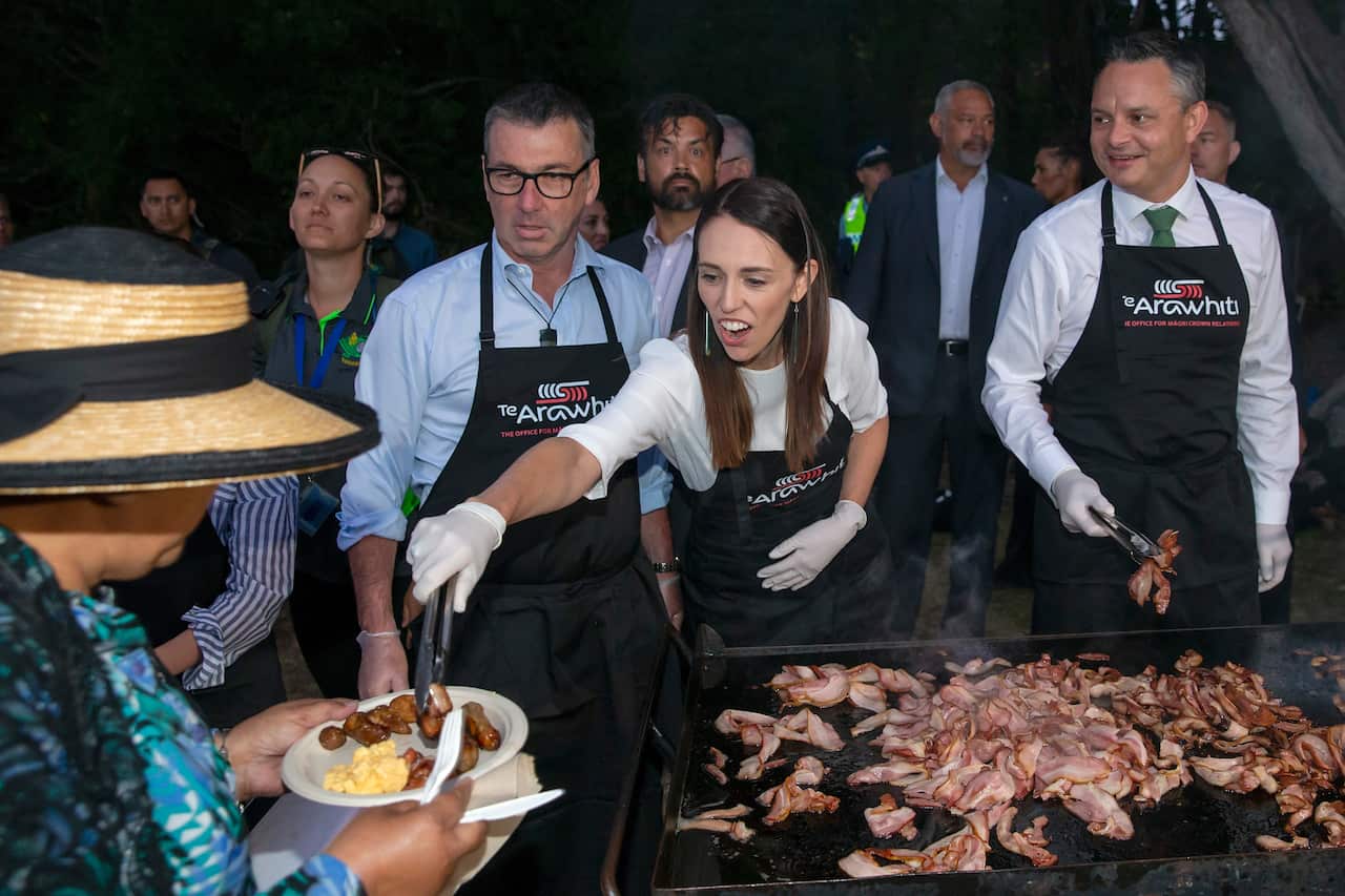 Duncan Webb, Labour MP for Christchurch Central, left, Jacinda Ardern, New Zealand Prime Minister  and James Shaw, Climate Change Minister serve up the barbecue