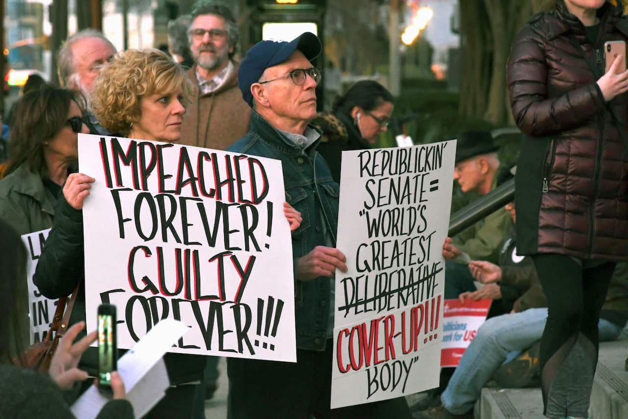 People protest in Los Angeles after US President Donald Trump was acquitted of charges of abuse of power and obstruction of Congress.