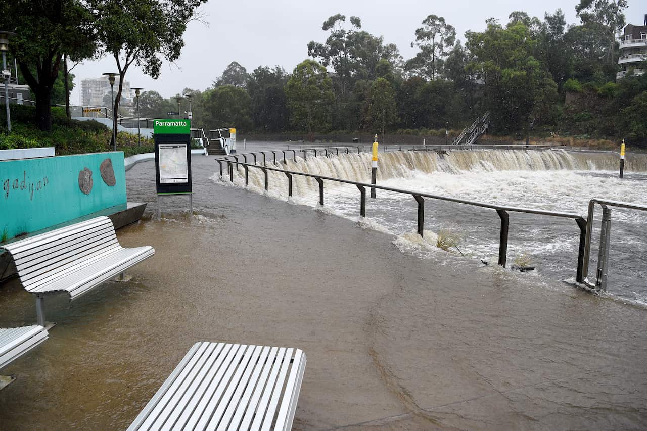 Water overflows the banks of the Parramatta River after heavy rains buffeted Sydney.
