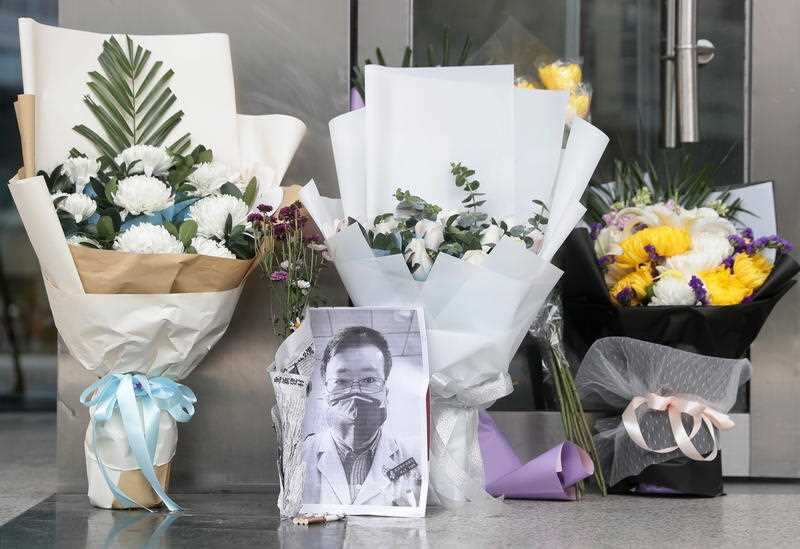 Flowers outside the Wuhan hospital where Chinese whistleblower doctor Li Wenliang died.