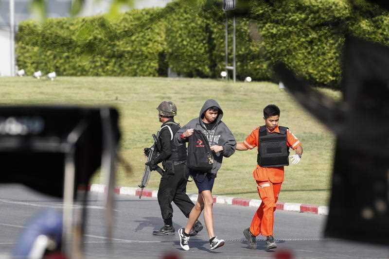 Soldiers evacuate hostages from mass shooting scene at the Terminal 21 shopping mall