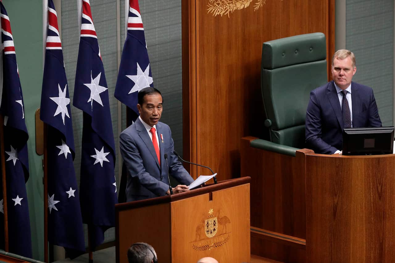 Indonesia President Joko Widodo, left, addresses the Parliament in Canberra.