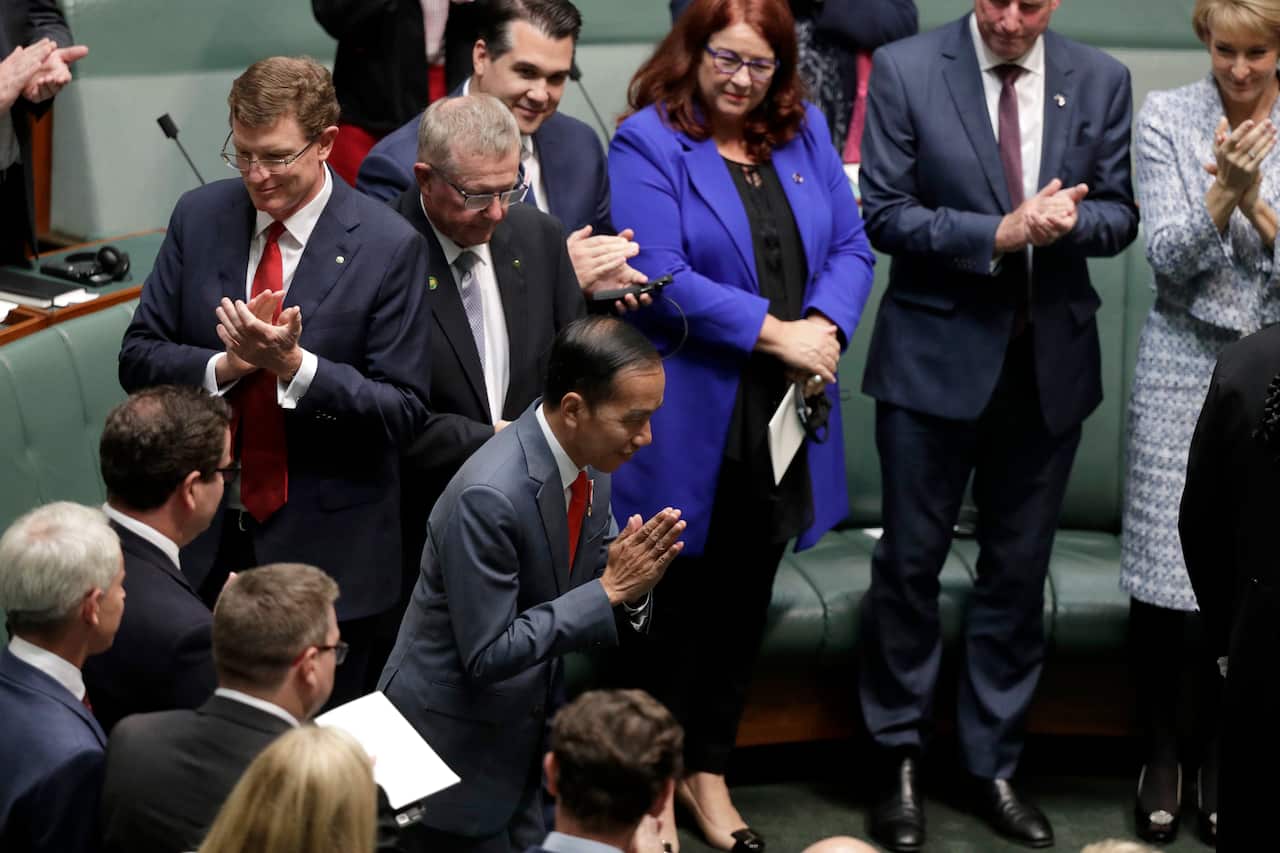 Indonesian President Joko Widodo is welcomed as he enters Parliament in Canberra.