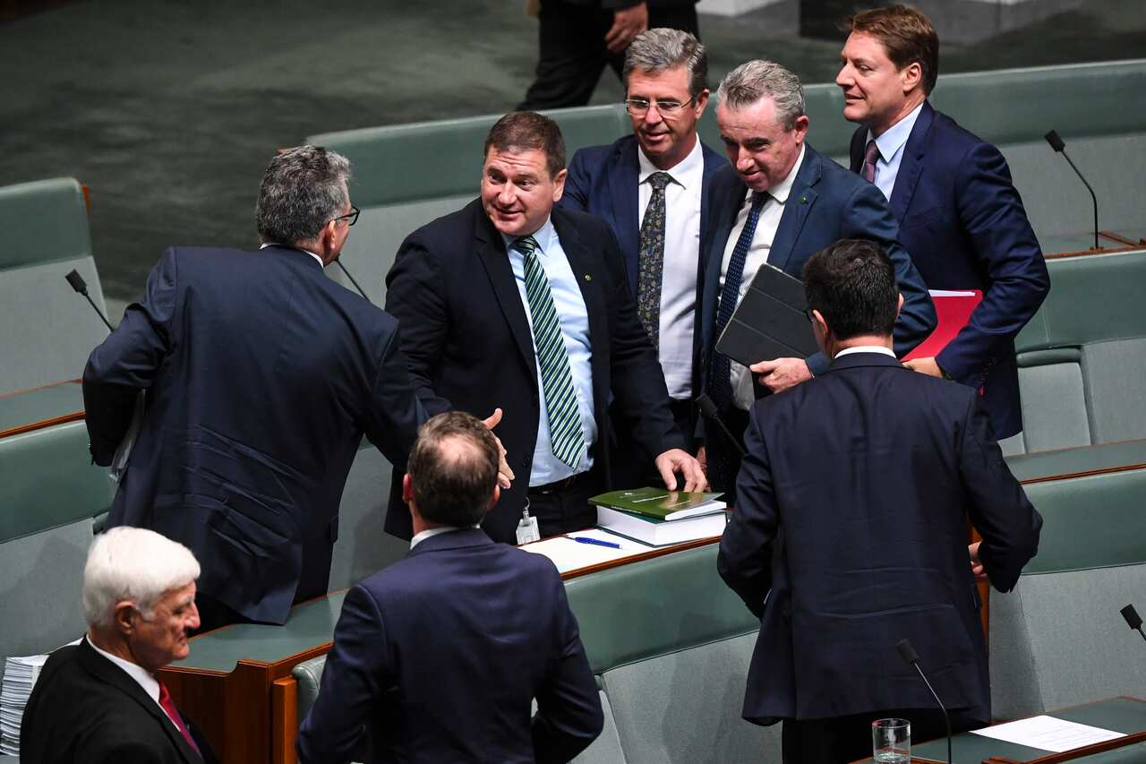 The member for White Bay Llew O'Brien (centre) is congratulated after being elected to the deputy speaker position in the House of Representatives at Parliament House in Canberra, Monday, February 10, 2020. (AAP Image/Lukas Coch) NO ARCHIVING