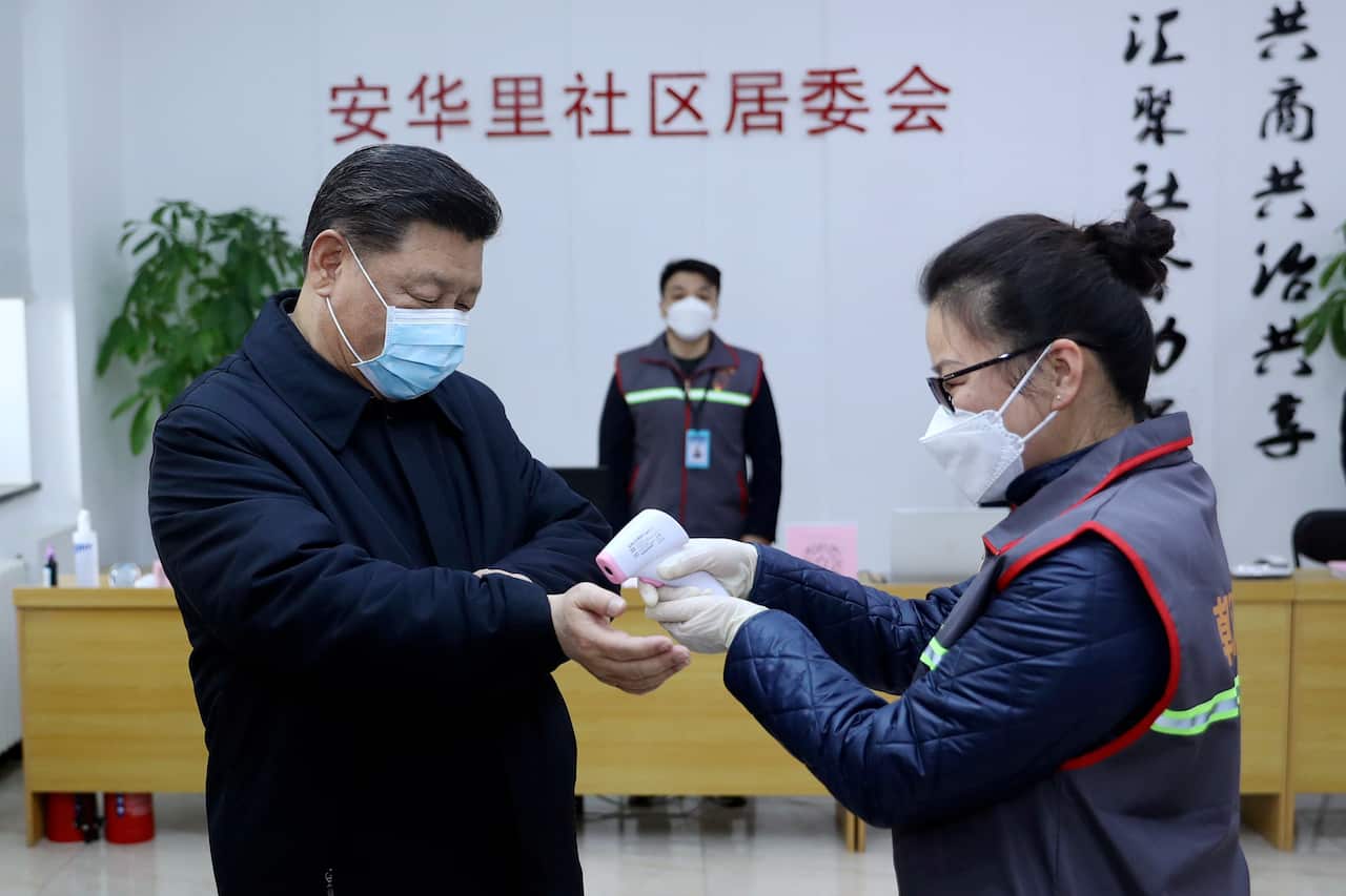Chinese President Xi Jinping receives a temperature check as he inspects the coronavirus pneumonia prevention and control work in Beijing earlier this year.