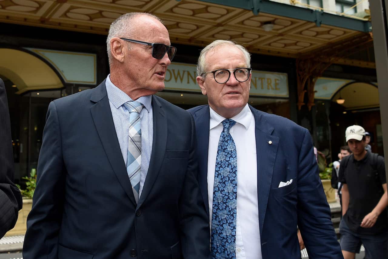 Chris Dawson (left) and his lawyer Greg Walsh (right) leave Downing Centre Local Court.