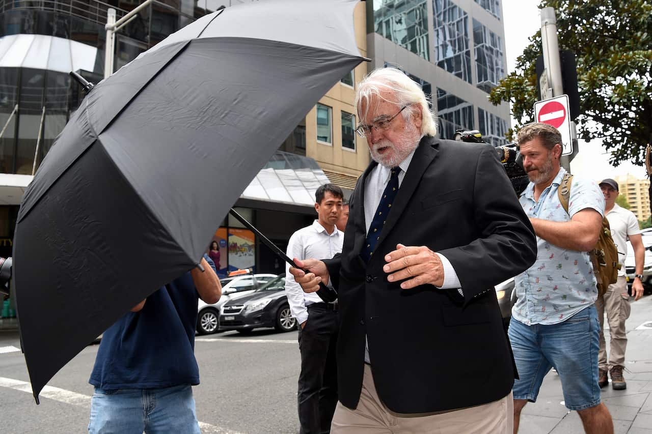 Witness Peter Breese leaves Downing Centre Local Court in Sydney on Wednesday.