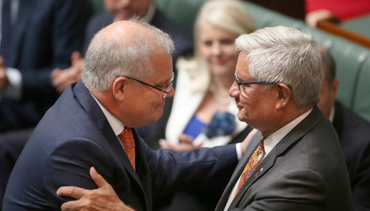 Prime Minister Scott Morrison, left, shakes hands with Minister for Indigenous Australians Ken Wyatt.