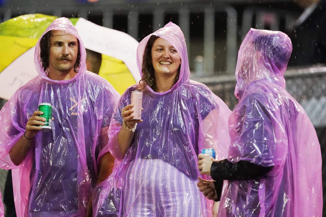 Fans brave the rain during the Round 2 AFLW match between the Western Bulldogs and Melbourne Demons at Whitten Oval in Melbourne.