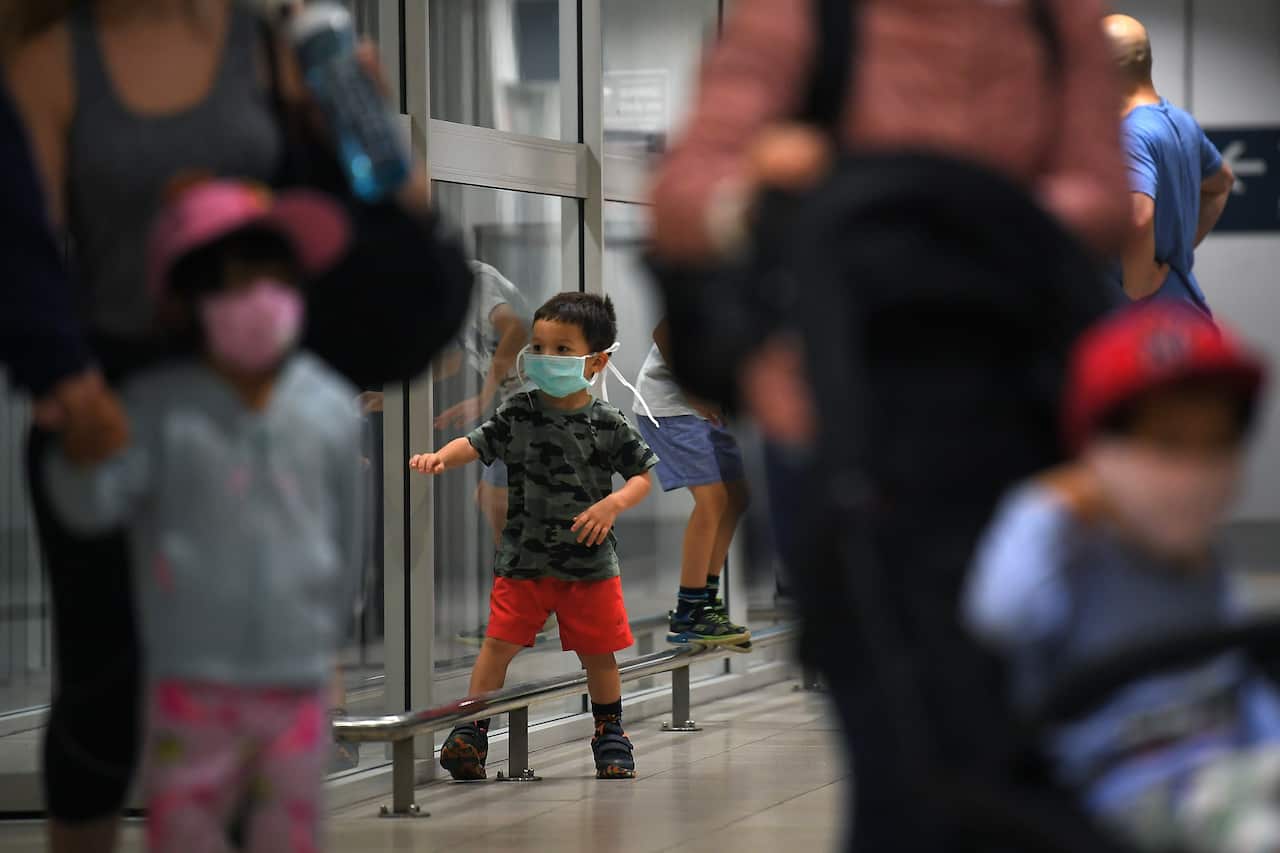 Australian evacuees who were quarantined on Christmas Island over concerns about the COVID-19 coronavirus arrive at Sydney Airport.