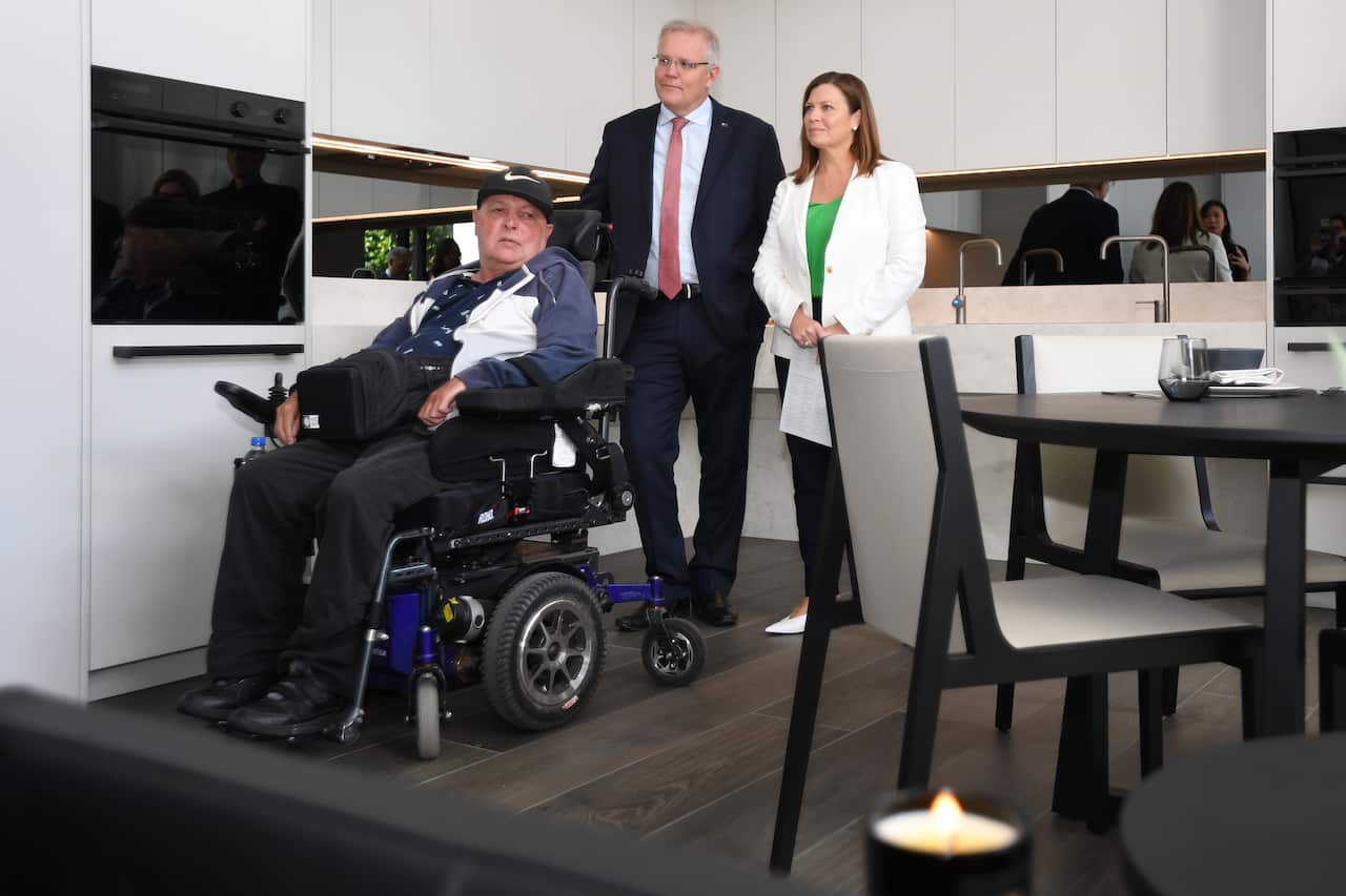 Prime Minister Scott Morrison and his wife Jenny meet resident Ricky Hackett during a visit to a disability home in Sydney in February.