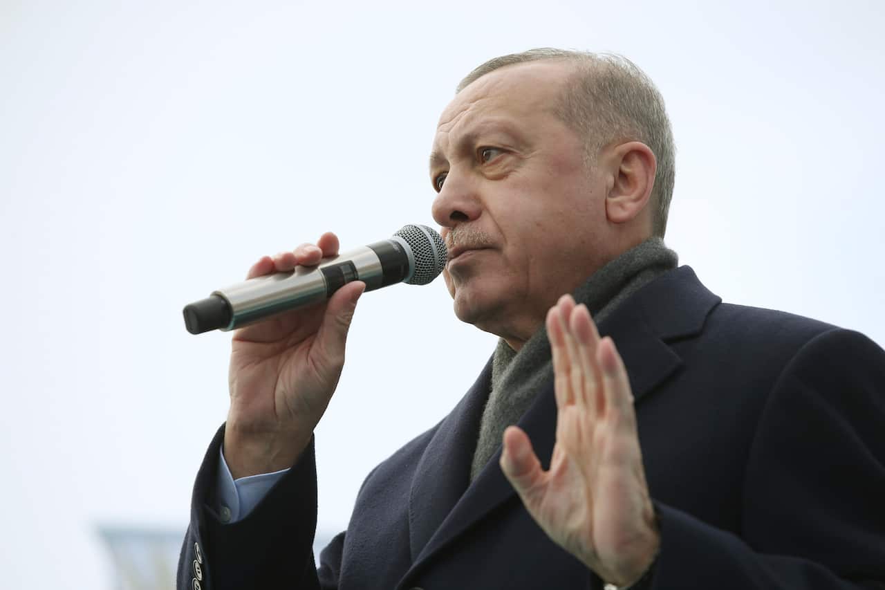 Turkish President Recep Tayyip Erdogan addresses his supporters, in Izmir, Turkey, Saturday, Feb. 22, 2020. 