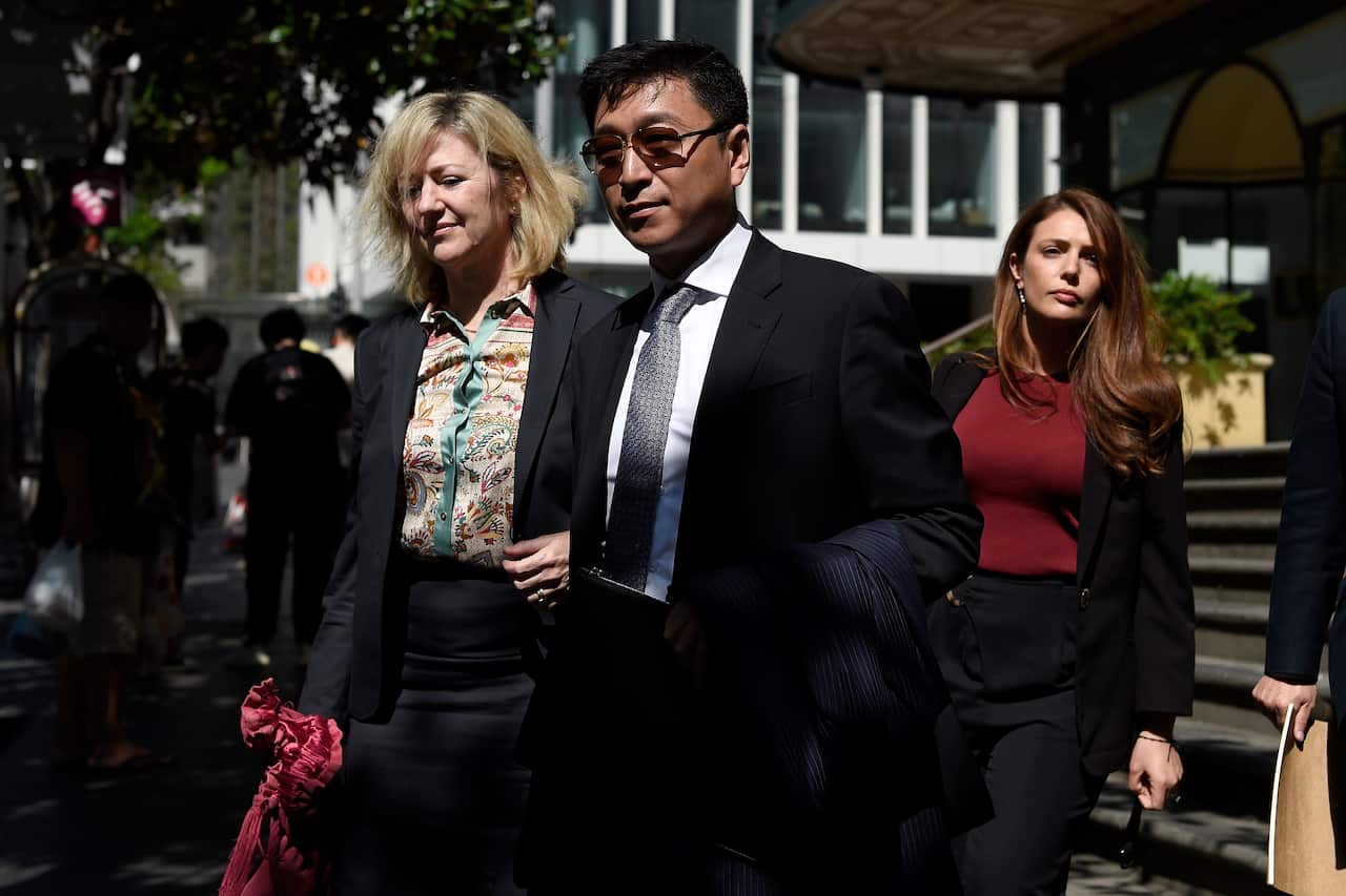 Producer Jing Wang (centre) was also cleared of all charges.Producer Jing Wang (centre) was also cleared of all charges.