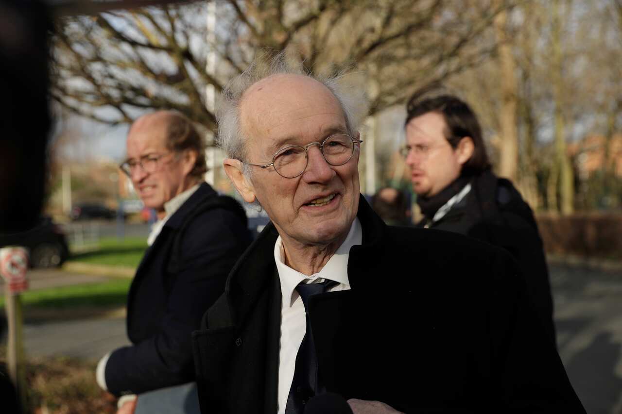 Julian Assange's father John Shipton (centre) speaks to the media.
