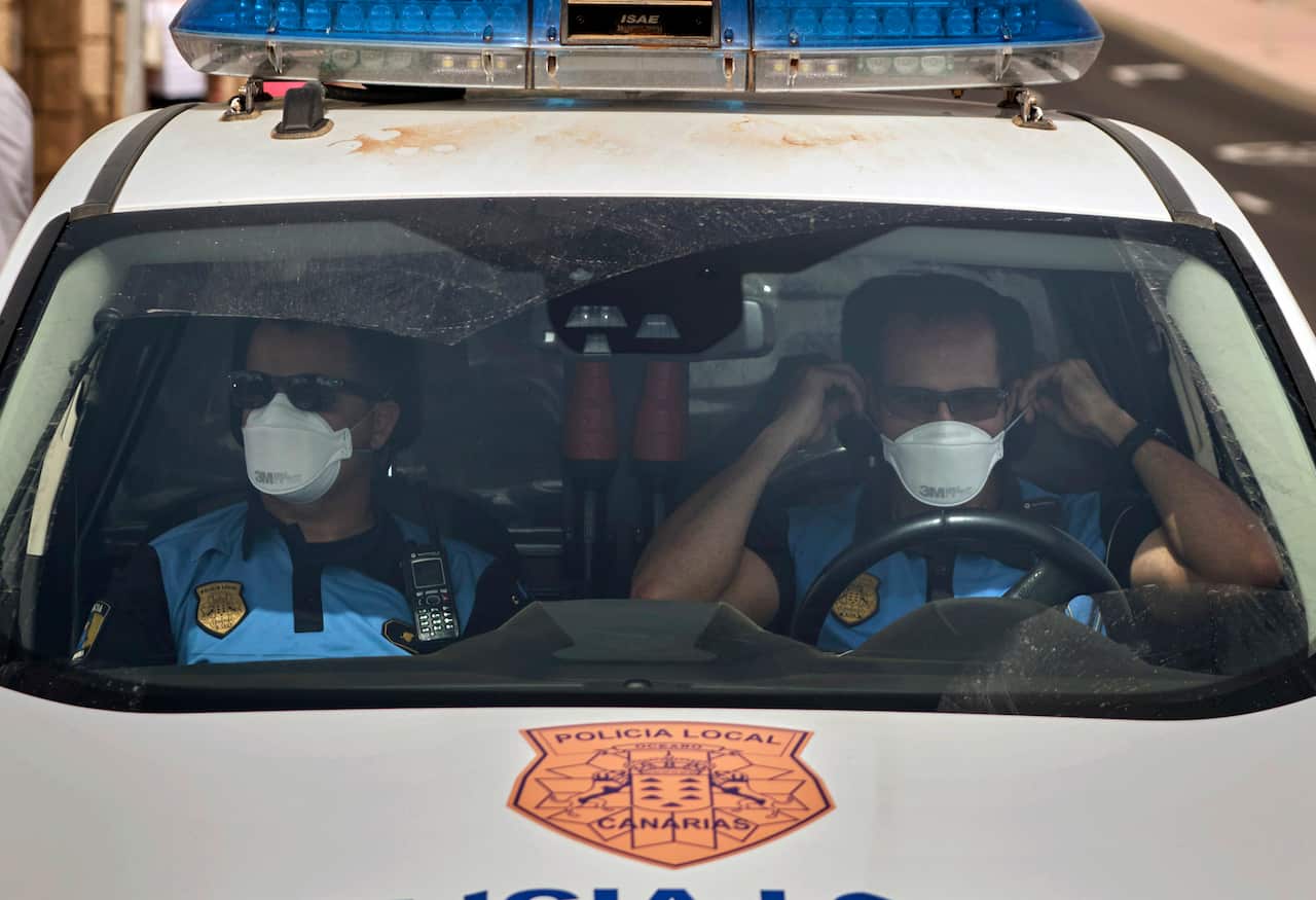 Spanish police officers patrol outside the hotel in Tenerife, Canary Island, Spain.