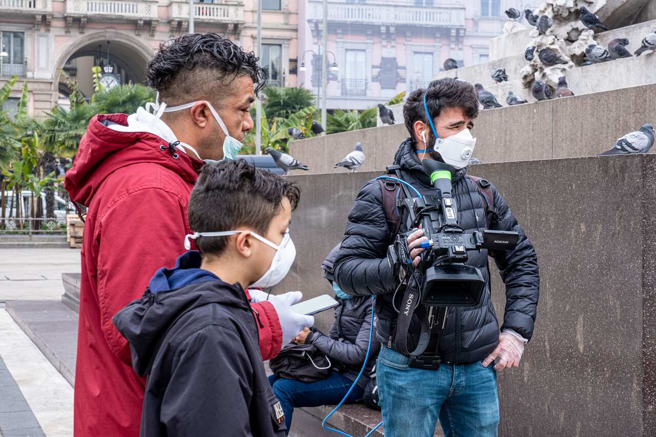 Tourists wearing facemasks in Milan, Italy, 25 February.
