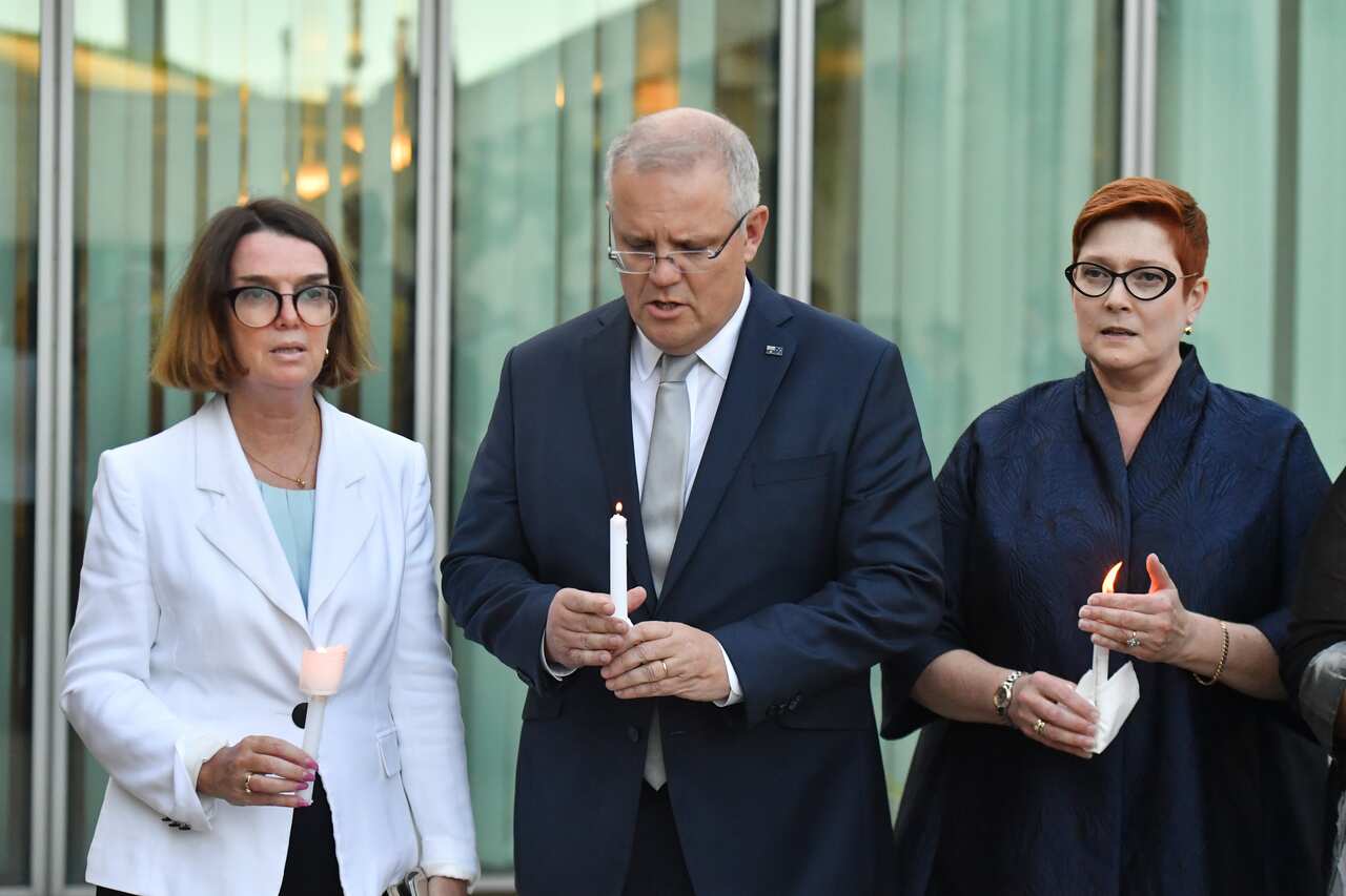Minister for Families Anne Ruston, Prime Minister Scott Morrison and Minister for Foreign Affairs Marise Payne attend the vigil