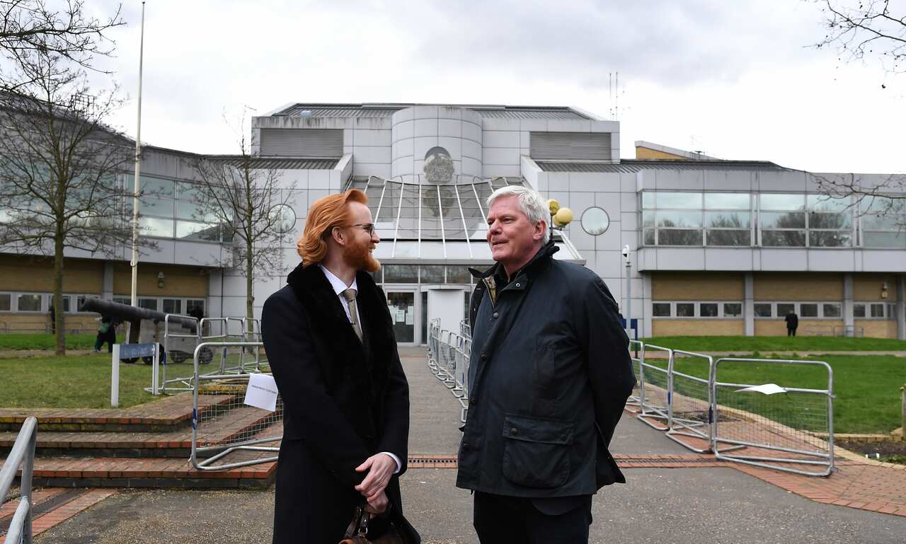 Editor in Chief of Wikileaks Kristin Hrafnsson (R) with Wikileaks Section Editor Joseph Farrell (L) outside Woolwich Crown Court in London.