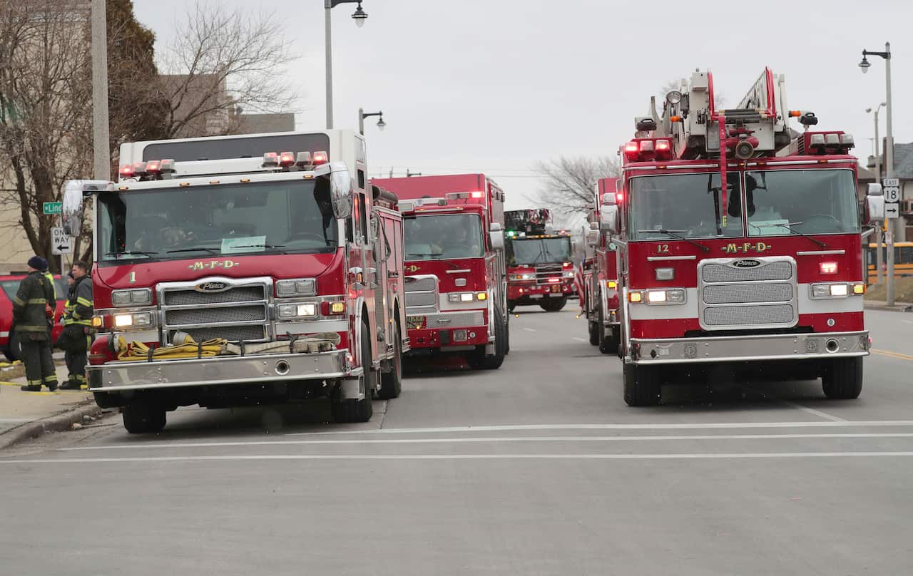Police and emergency officials work at the scene.
