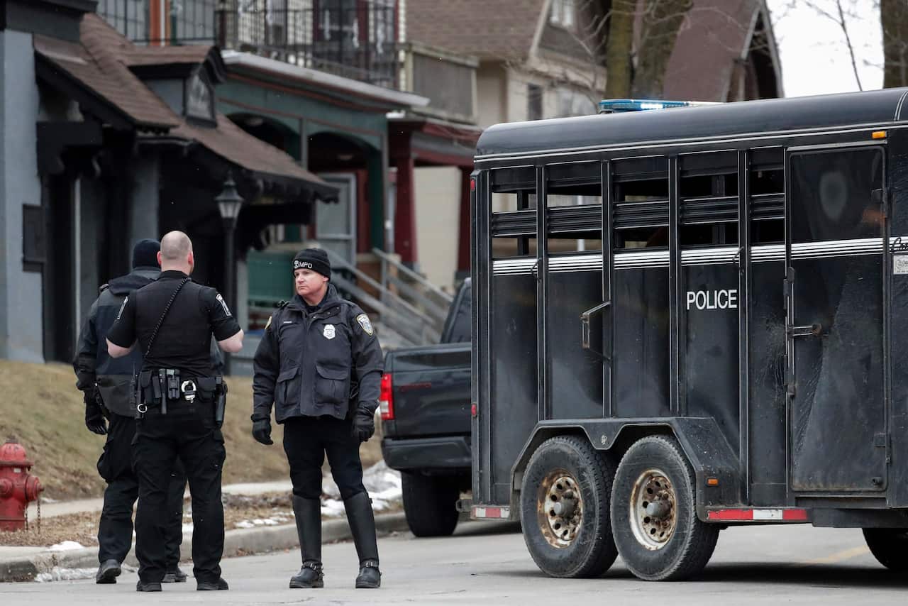 Police maintain a perimeter outside the Molson Coors Brewing Co. campus in Milwaukee.