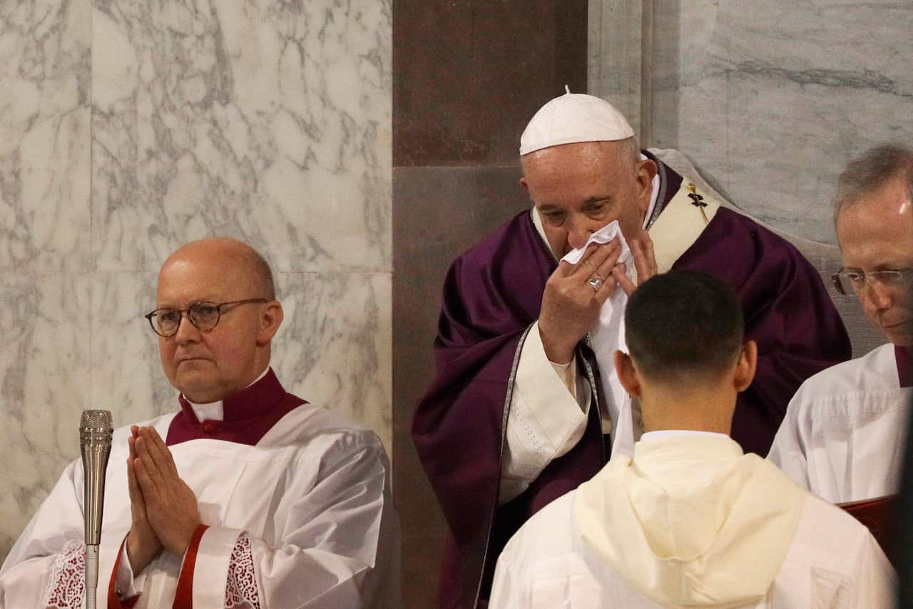 Pope Francis wipes his nose in the Santa Sabina Basilica as he marked the Ash Wednesday mass opening Lent.