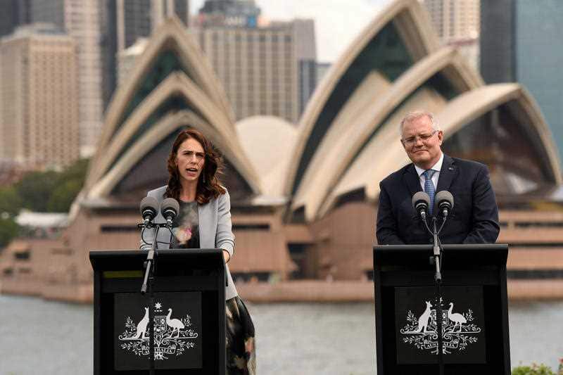 New Zealand Prime Minister Jacinda Ardern (left) and Australian Prime Minister Scott Morrison speak to the media 