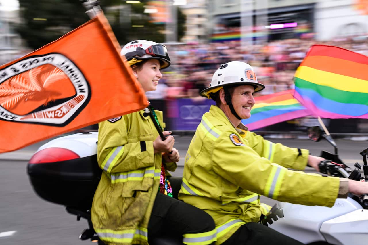 Volunteer firefighters taking part in Sydney's 42nd annual Mardi Gras parade.