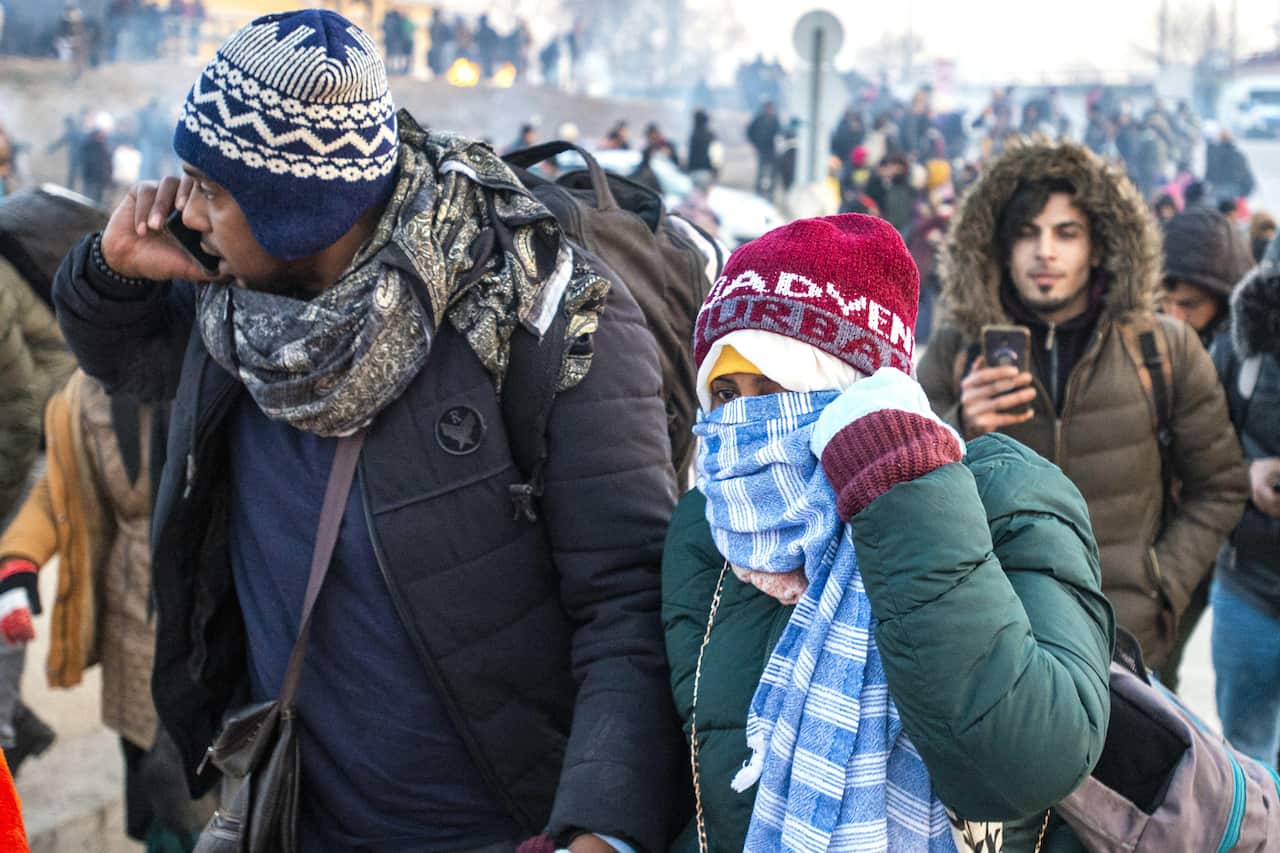 Refugees wait in front of the Greek border at Pazarkule gate, in Edirne, Turkey, on 1 March, 2020.