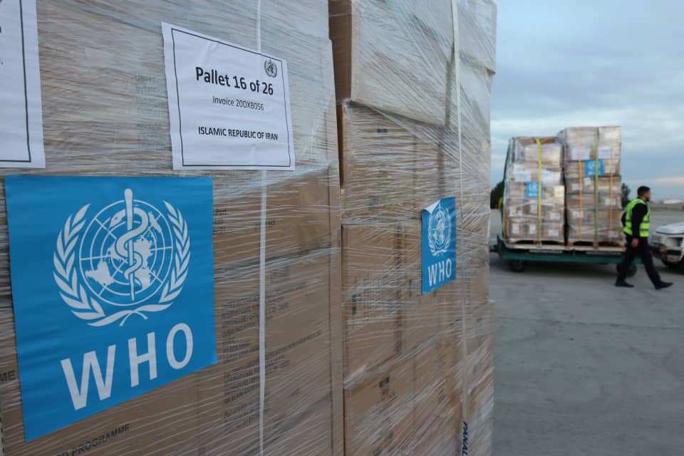 Iranian health ministry photo shows laborers unloading medical equipment and coronavirus testing kits provided by the World Health Organisation. 