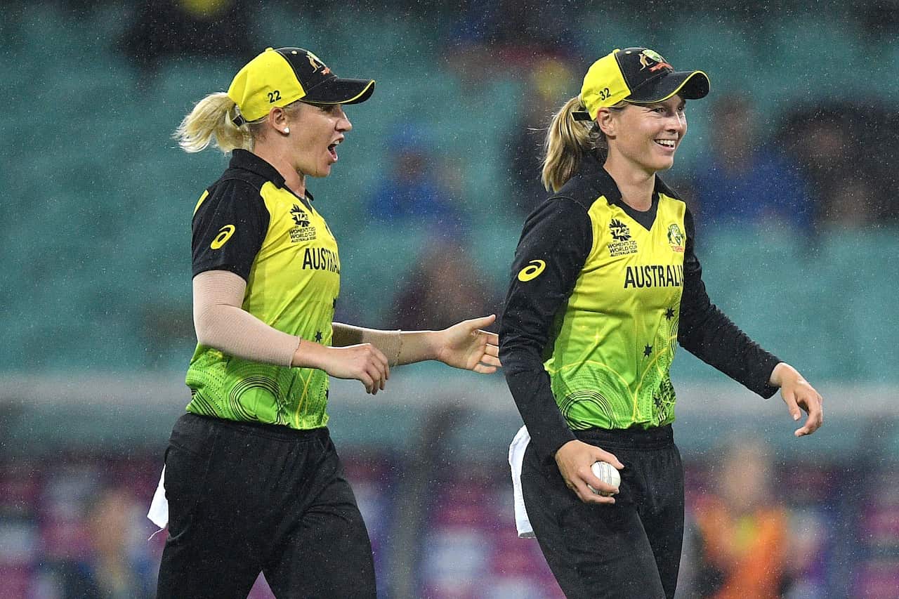 Meg Lanning of Australia (right) celebrates after taking a catch to dismiss Chloe Tryon of South Africa from the bowling of Jess Jonassen.
