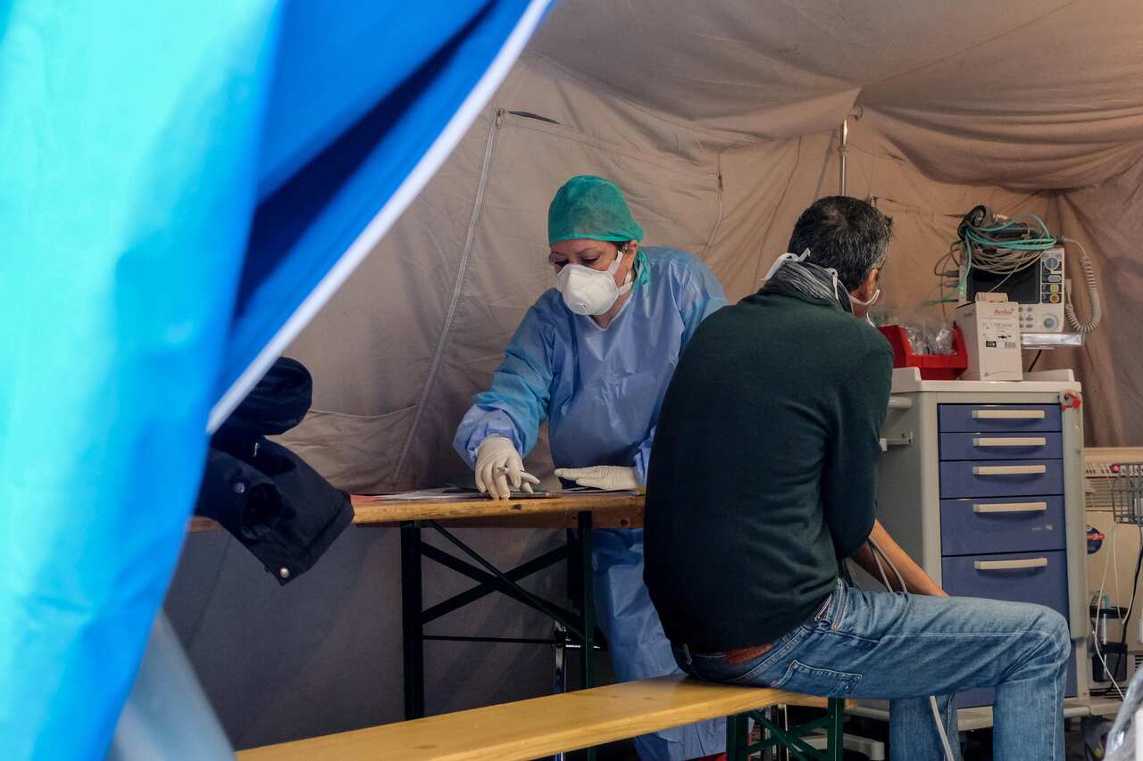 A doctor in a coronavirus pre-triage tent in Palermo, Italy.