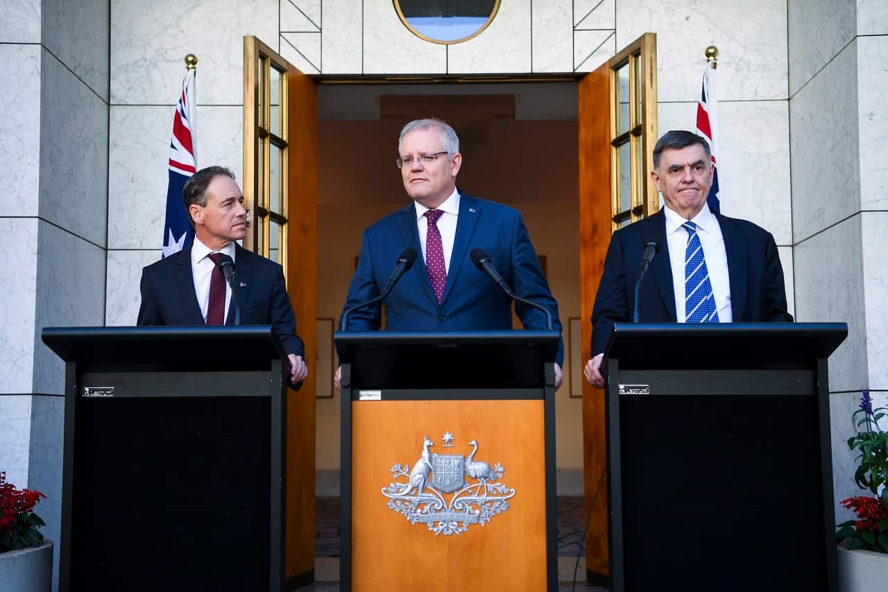 Greg Hunt, Scott Morrison Brendan Murphy speak to the media on Wednesday.