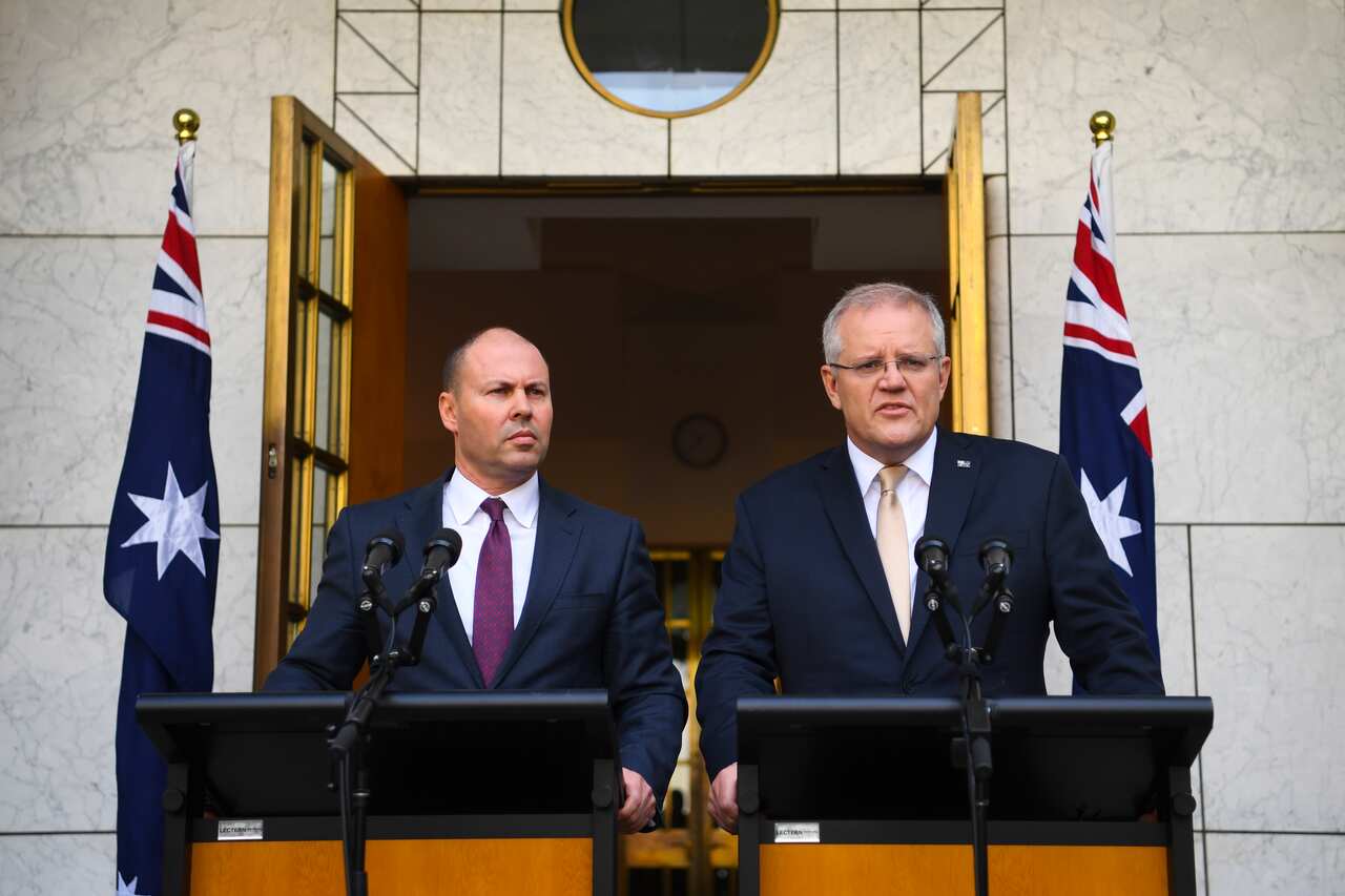 Australian Prime Minister Scott Morrison (right) and Australian Treasurer Josh Frydenberg speak to the media during a press conference at Parliament House in Canberra, Thursday, March 12, 2020. (AAP Image/Lukas Coch) NO ARCHIVING