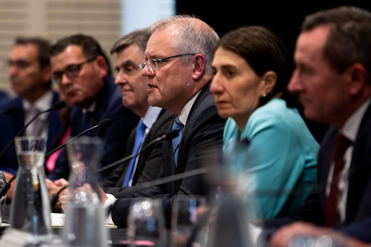 Prime Minister Scott Morrison is seen alongside then Chief Medical Officer Brendan Murphy other state leaders at a COAG meeting in March.