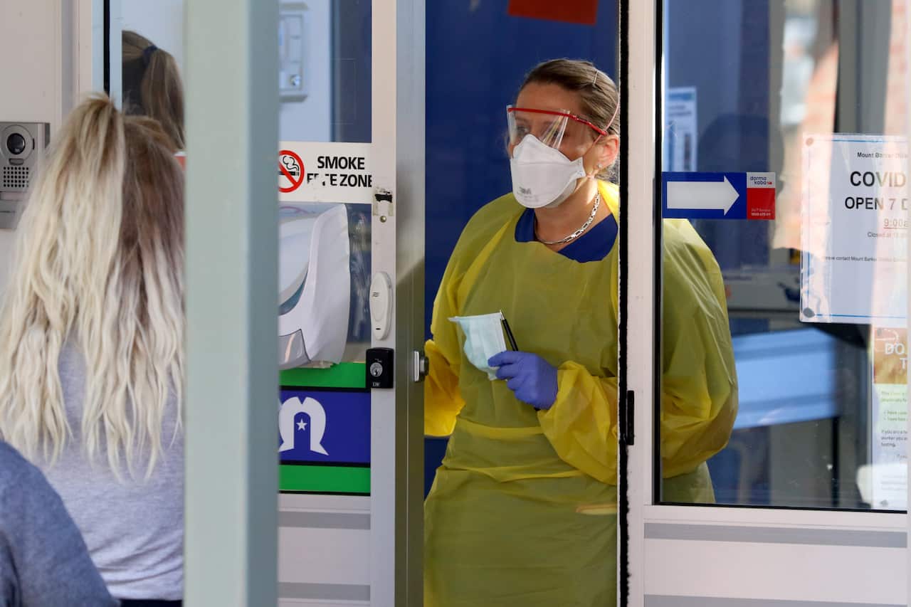 A nurse speaks with patients at the door of the new Covid-19 Clinic at the Mount Barker Hospital in Adelaide, Tuesday, 17 March, 2020.