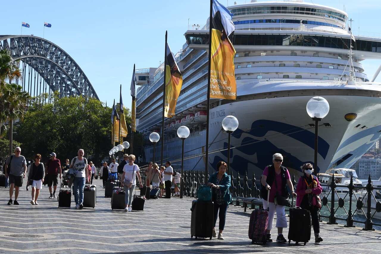 Passengers disembark from the Ruby Princess at Circular Quay in Sydney. 