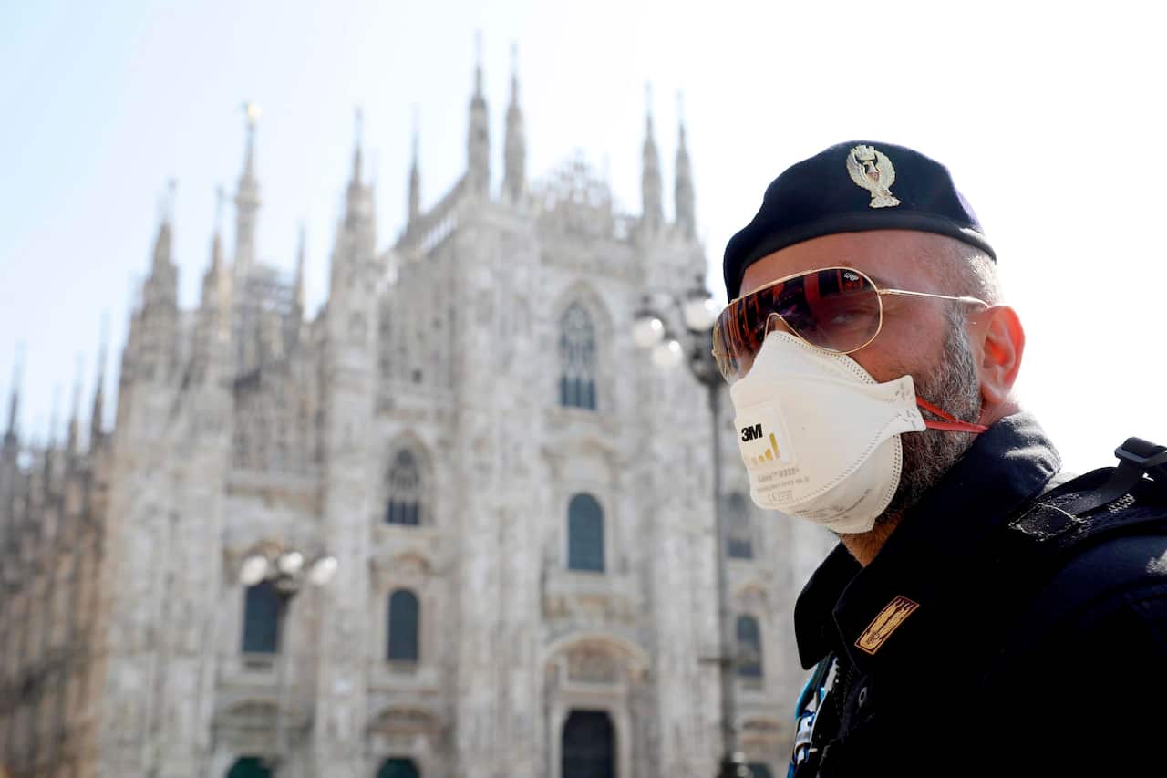 Italian police patrol Milan.