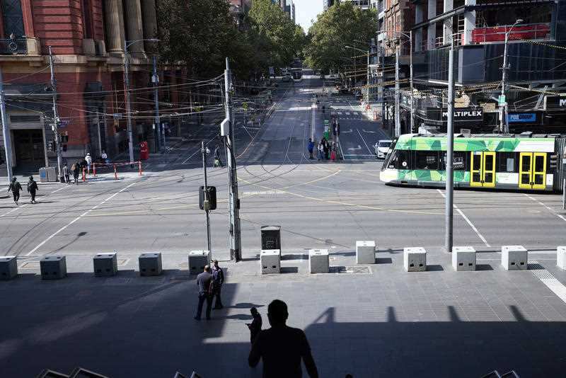 Melbourne streets are quiet as Australia shuts down non-essential services.