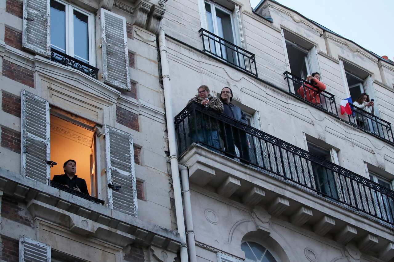 French tenor singer Stephane Senechal sings from his apartment window in Paris.