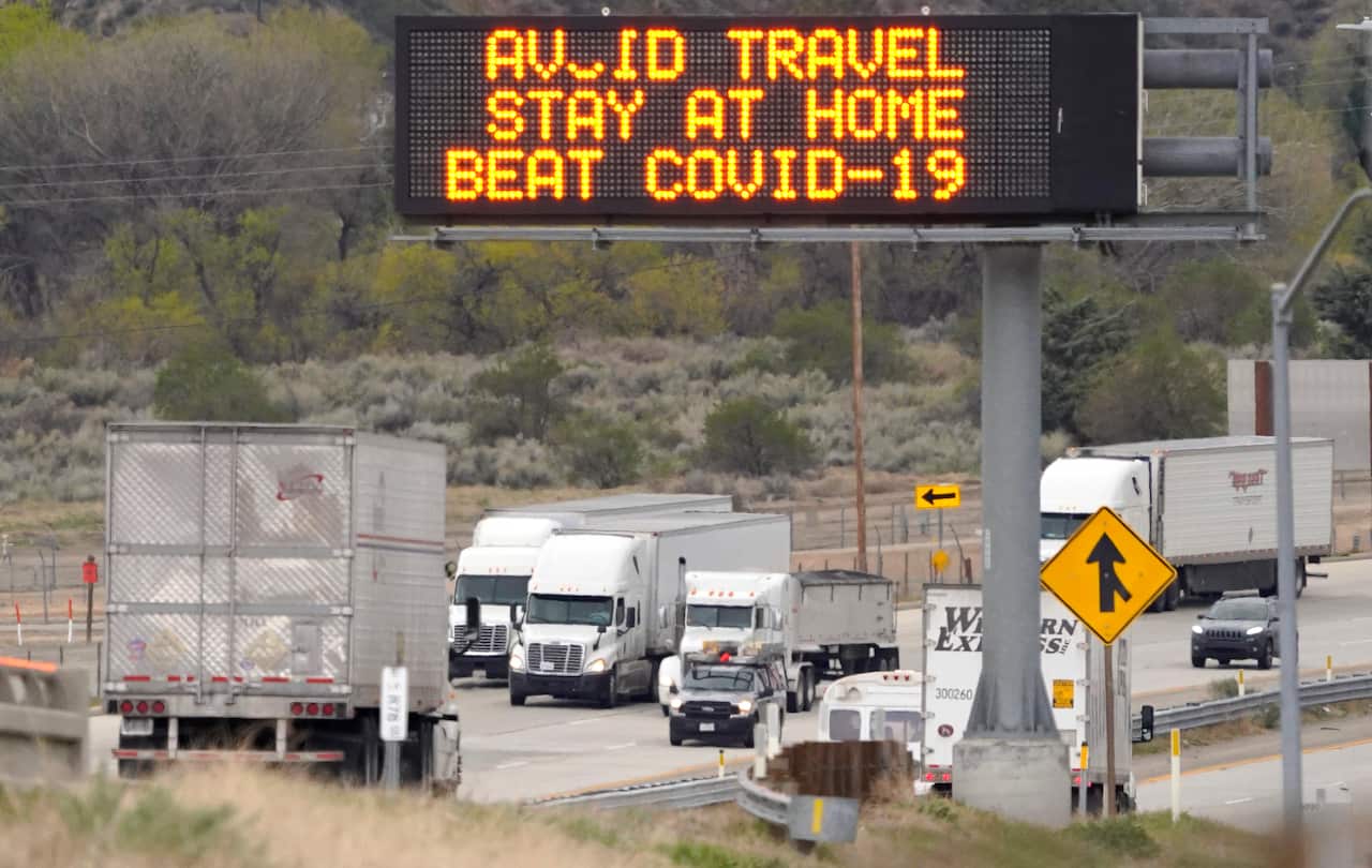 A freeway sign urges people on their way into Los Angeles to stay at home due to the coronavirus outbreak.